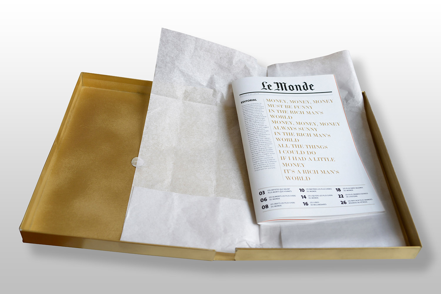 Artwork photographer - Photograph of a gold concept box containing documents from the newspaper Le Monde, by Nadège De la Tour de Pin.
