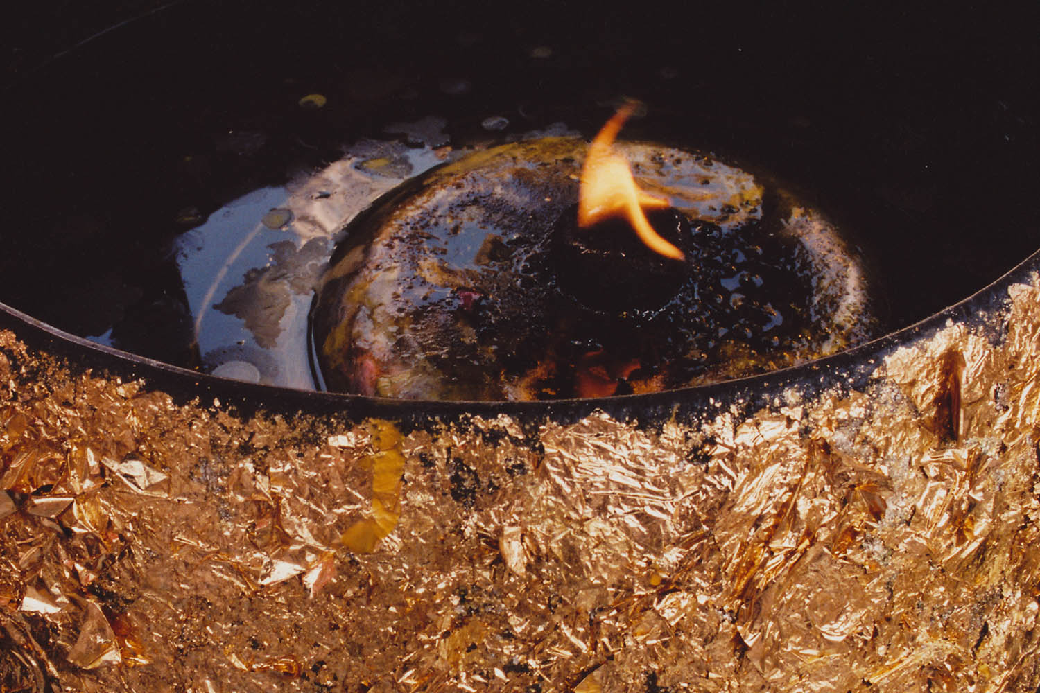 Fine art photography - Detail of a bowl covered in gold leaf, Wat Pho, Bangkok, Thailand.