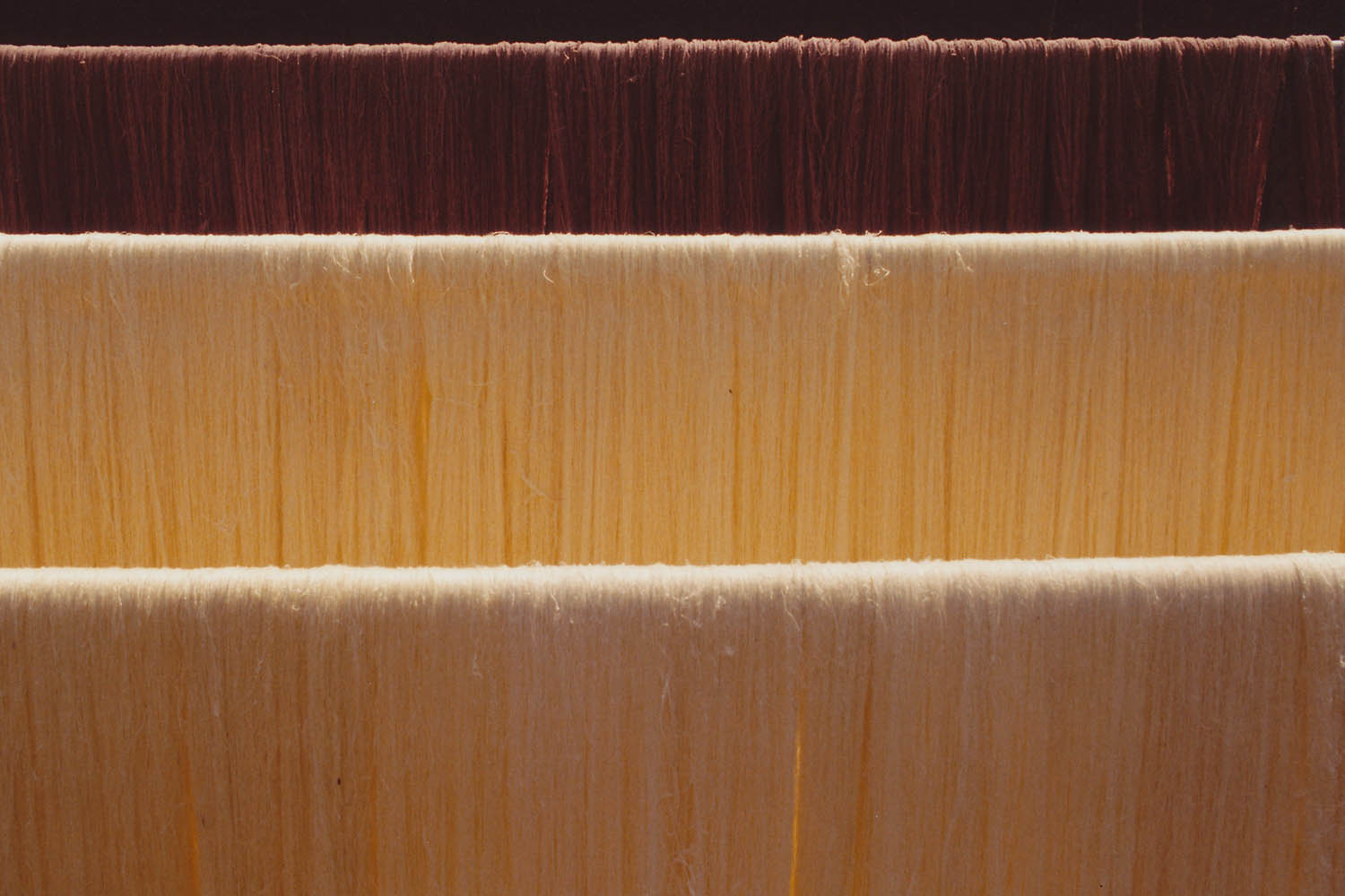 Fine art photography - Detail of silk drying in the sun in Chiang Mai, Thailand.